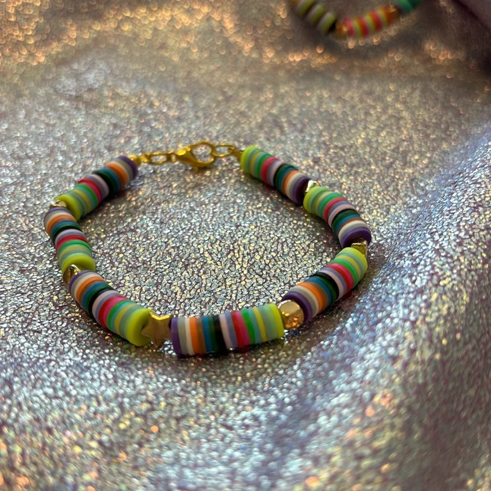 Girls multi colored clay beads bracelet with gold star and block charms. - Picture 5 of 6
